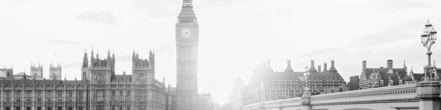 The Elizabeth Tower and Houses of Parliament in evening sunlight.